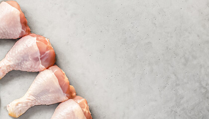 raw chicken, chicken drumsticks. top view of raw chicken legs on grey background, copy space