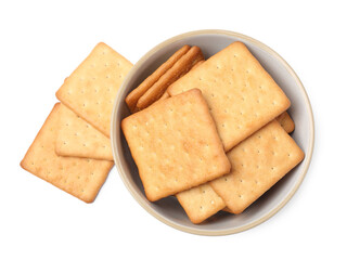 Tasty crackers in bowl isolated on white, top view