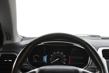 Speedometer on dashboard and steering wheel inside car
