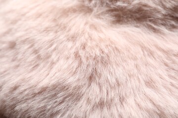Texture of pink faux fur as background, closeup