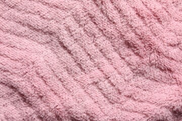 Texture of pink faux fur as background, top view