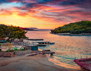 Attractive spring sunset in Ksamil town. Wonderful evening seascape of Ionian sea. Calm outdoor scene of Butrint National Park, Albania, Europe. Traveling concept background. - 780384395