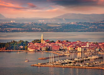 Spectacular summer sunset on Izola port in southwestern Slovenia on the Adriatic coast of the...