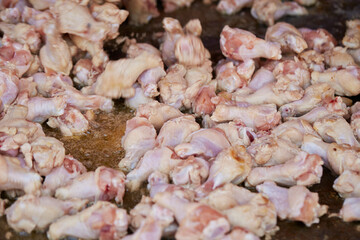 raw chicken legs in a pan