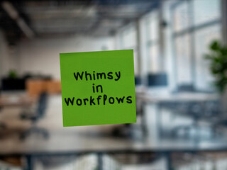 Post note on glass with 'Whimsy in Workflows'.