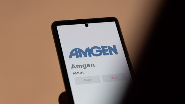 April 04th 2024. The logo of Amgen on the screen of an exchange. Amgen price stocks, $AMGN on a device.