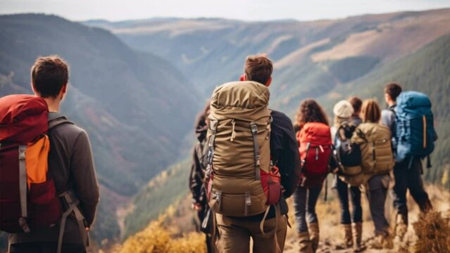 Group of men and women hikers with backpacks
