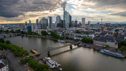 Aerial view of Main River with a modern city at the shore with fluffy clouds in the sky