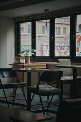 Vertical shot of empty chairs in a cafe.