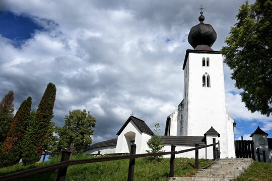 Church of Holy Spirit with a cloudy blue sky in the background Zegre, Slovakia