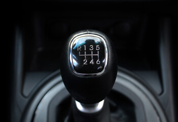 Close up Manual gear stick inside modern car. Manual gearbox lever. Detail on a Manual gear shifter...