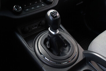 Manual gear stick inside modern car. Manual gearbox lever. Detail on a Manual gear shifter in a...