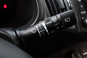 Car windshield wiper switch. Wipers switch control. Adjusting speed wipers in car. Wiper switch...