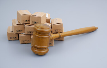 Consumer laws concept. Judge gavel and many carton boxes.	