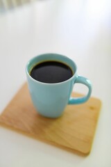 Closeup of coffee in a blue cup