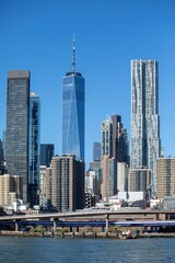 Fototapeta na wymiar Vertical shot of the New York city skyline on a sunny day