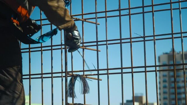 Builders Lay Metal Fittings At Construction Site