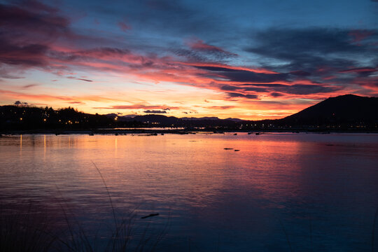 scenic sunset with clouds in winter over txingudi bay in hendaye