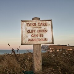 Warning sign about dangerous cliff edges