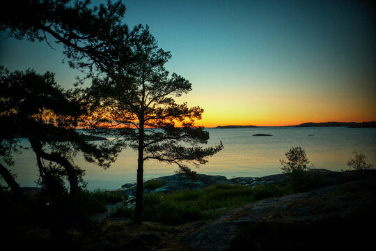 Scenic view of sea against clear sky during sunset