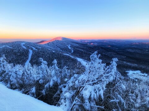 Scenic shot of hills covered with snowy trees in Killington Ski Resort, Vermont, New England, Canada