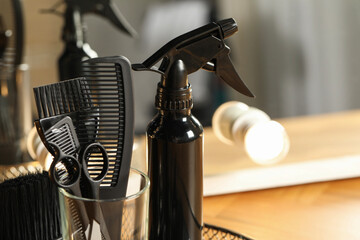 Set of hairdresser tools in salon, closeup. Space for text