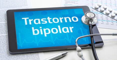 A tablet with the word Bipolar disorder in spanish on the display
