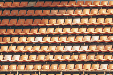 Large Aligned yellow rows of empty theater seats