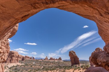 Sandstone Arch at Arches national park with blue cloudy sky in Utah - USA