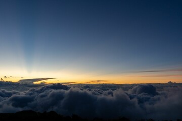 Beautiful shot of a layer of dark blue clouds in a sunset sky