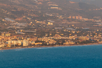 Panoramic view from Alanya Castle on city Buildings during sunset