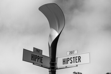 Grayscale of street signs of Hippie in 1967 and Hipster in 2017, before and after concept