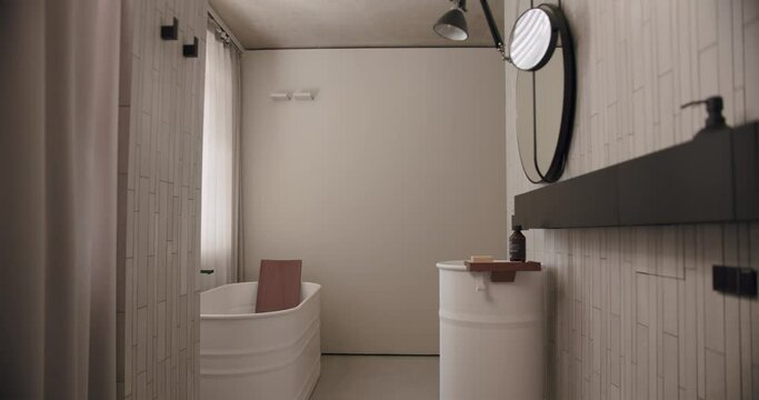 Luxury Bathroom Interior, minimalist interior in white colors with bathroom accessories , mirror and shower head, round mirror in modern interior, bathtub modern design