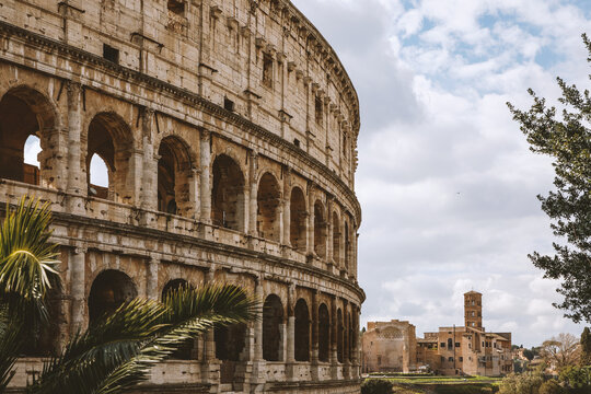 Famous arches on the Roman Colosseum facade. Coliseum at springtime.