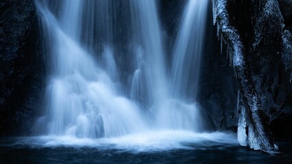 Closeup of a waterfall with long exposure effect at dawn
