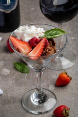 Ice cream dessert with berries in a glass cup
