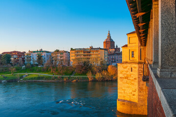 Panorama of Ponte Coperto (covered bridge) and Duomo di Pavia (Pavia Cathedral) in Pavia at sunny day, Lombardy, italy. - obrazy, fototapety, plakaty