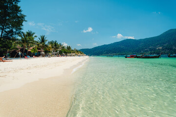 Beach and clear blue water in summer and vacation