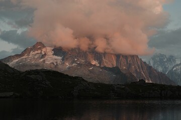 Fototapeta premium View of pink clouds covering the Mont Blanc massif mountaintop