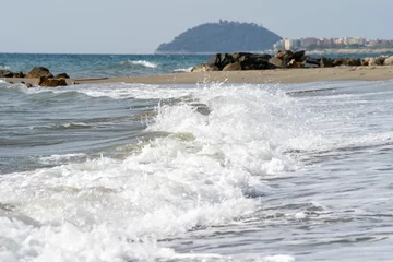 Foto op Plexiglas Beautiful view of waves washing the shore in Liguria Italy © Wirestock