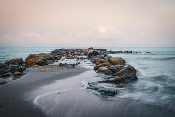 Rolgordijnen Beautiful view of waves washing the rocky shore in Liguria Italy © Wirestock