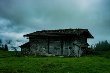 Old wooden country house in cloudy weather in Austria.
