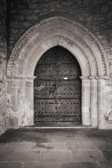medieval church door in black and white