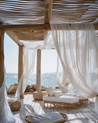 Mediterranean patio with sunbeds and white curtains, summer vacations - 780468116