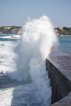 huge splash of wave against dike in Socoa, basque country