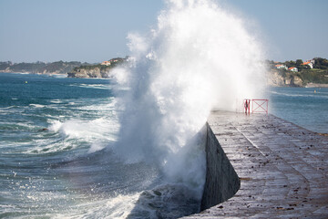 huge wave splashing against the dike