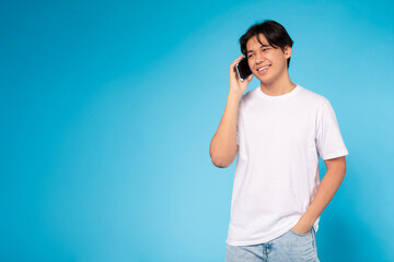 Young guy talking on the phone happily