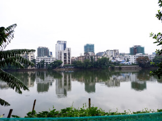 Fototapeta na wymiar Gulsan lake, Dhaka, Bangladesh. 28 June 2023. Residential area.