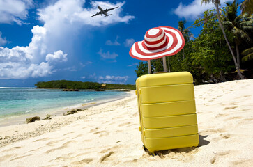 The yellow luggage on the beach- summer travel concept