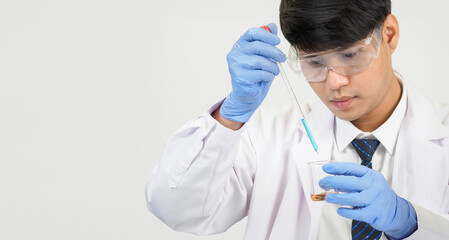 Portrait asian man student scientist or doctor look hand holding reagent mixing laboratory in science research laboratory with test tubes of various size in  laboratory chemistry lab white background